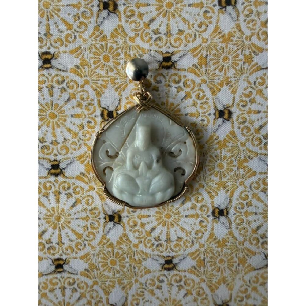 HAND -CARVED NATURAL JADE PENDANT